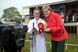 Champion Junior Handler recieves her prize from Mairead McGuinness
